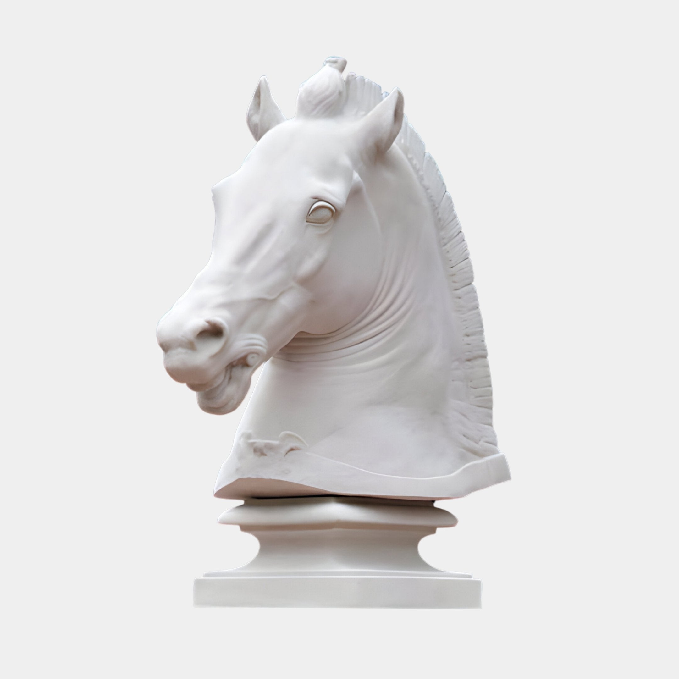 The Noble Horse Head White Marble Outdoor Sculpture by Giant Sculptures, standing at 120cm, features a realistic horse head in profile with a flowing mane and slightly open mouth, mounted on a simple pedestal against a light background.