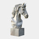 The Elegant Horse Head White Marble Outdoor Sculpture by Giant Sculptures stands 120cm tall, featuring a flowing mane and intricate details carved into its smooth texture, mounted on a square base for an eye-catching look against any plain background.