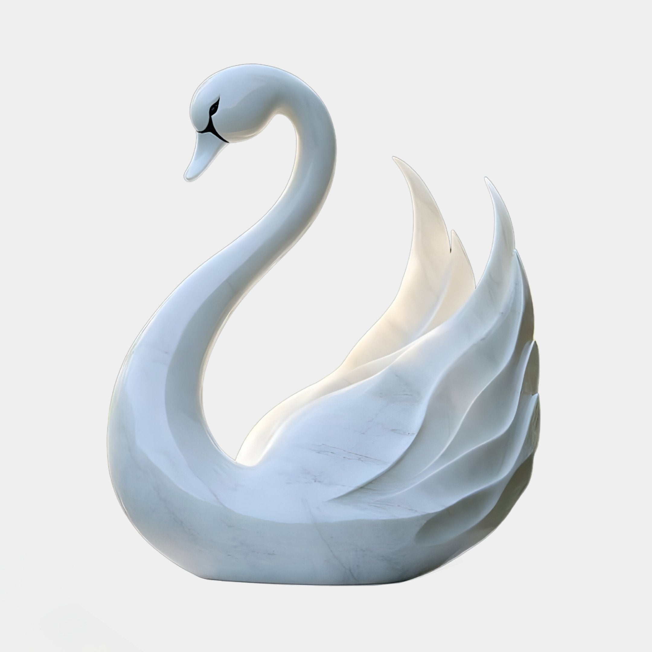 The Radiant Swan White Marble Outdoor Sculpture by Giant Sculptures features a graceful, curved neck and stylized wings, enhancing any serene setting with its elegant design. Perfect for outdoor decor, this 100cm masterpiece adds flow and beauty to any space.