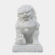 The Chinese Guardian Lion Marble Outdoor Sculpture by Giant Sculptures is a hand-carved white marble statue with intricate details. It stands on a decorated pedestal, showcasing the lion's fierce expression and one paw resting on a carved orb.