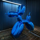 Ocean Blue Dog Sculpture by Giant Bears in a modern industrial setting, showcasing its vibrant blue reflective finish. Perfect for contemporary interiors or as an outdoor statement piece.