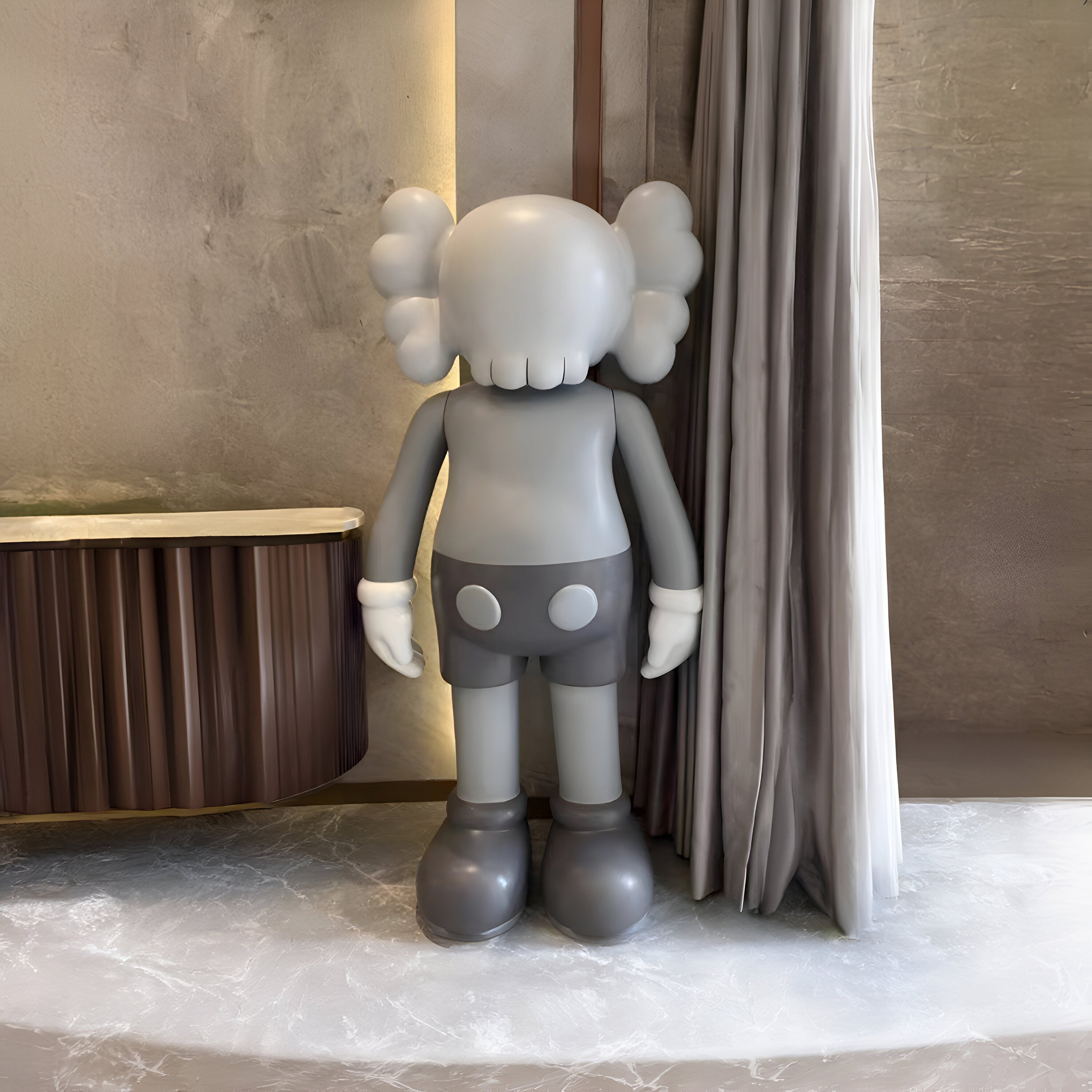 Slate Grey Iconify standing sculpture, side view, sophisticated grey figure, elegant and serene in a modern setting.