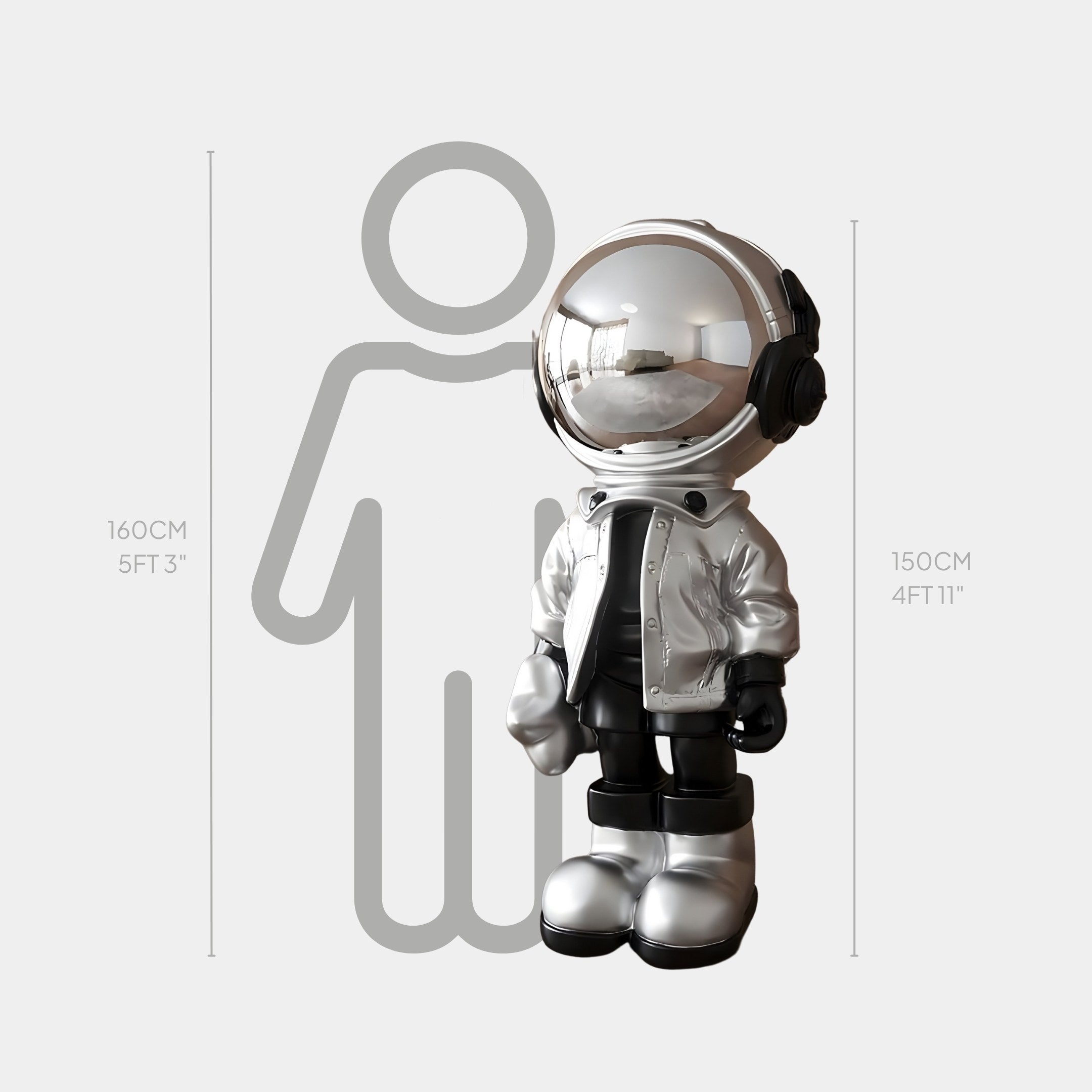 The Lunar Silver Astronaut Beats Sculpture by Giant Sculptures, measuring 150 cm tall, pairs with a 160 cm gray outline of a person to create a futuristic touch for any space.