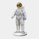 The White Space Astronaut Standing Sculpture by Giant Sculptures, measuring 58 cm, boasts a striking design with a shiny gold visor. Adorned with gray straps and red accents, it stands upright on a round base against a plain background, capturing the essence of space exploration.