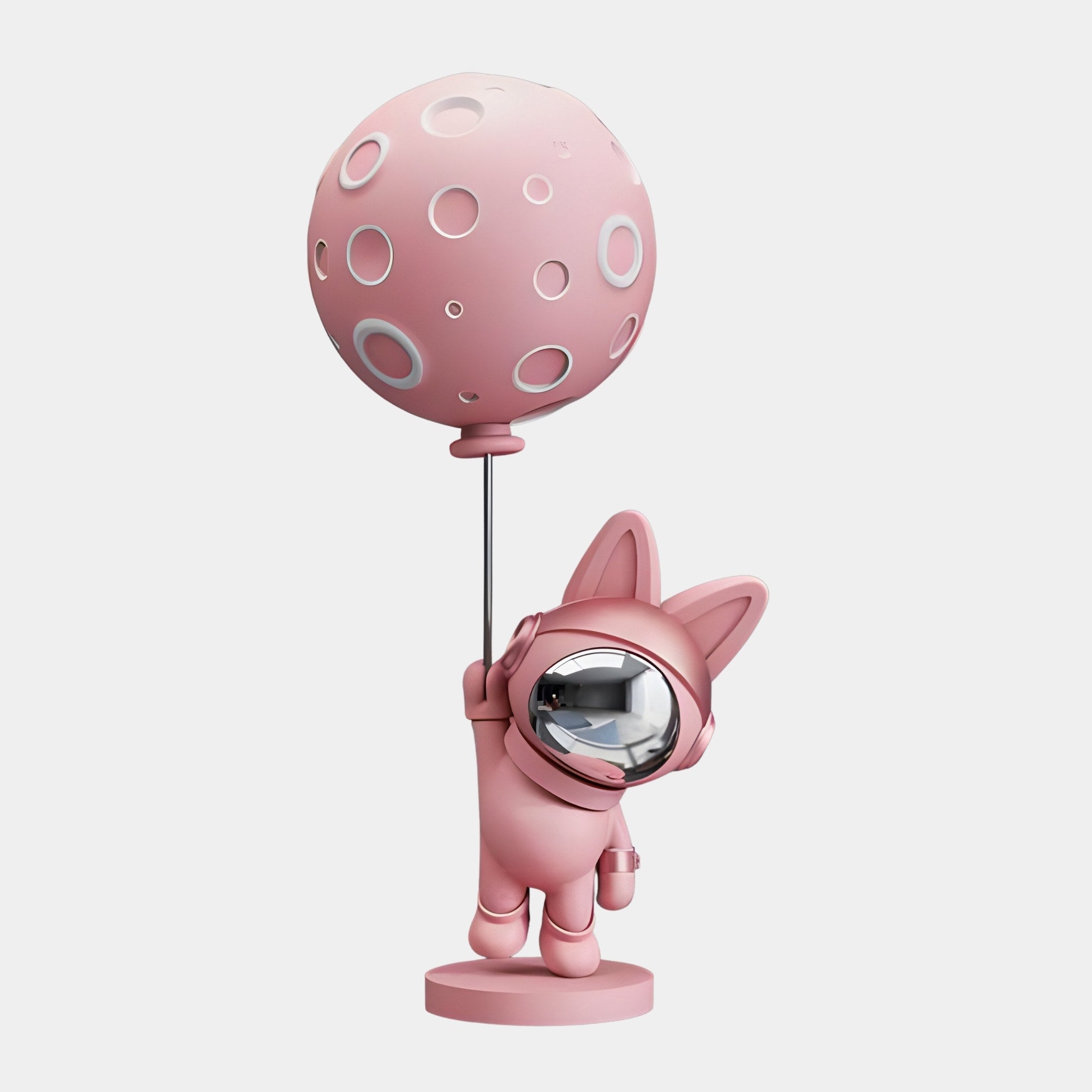 The Candy Pink Astronaut Bunny Moon Balloon Sculpture by Giant Sculptures is a whimsical 60cm décor piece, featuring a charming moon balloon with craters. The bunny wears a helmet and stands on a round base, blending light pink with grey accents for an otherworldly charm.