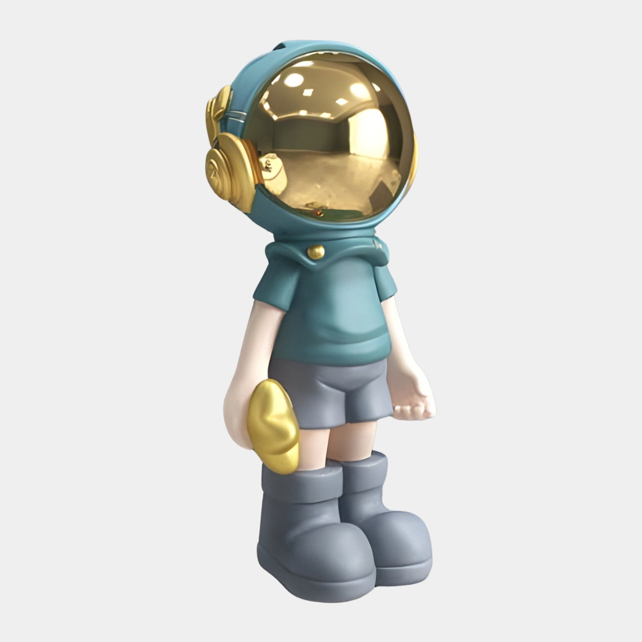 Meet the Galactic Blue Astronaut Buddy Sculpture by Giant Sculptures—a stunning 70cm space-themed décor piece. With its glossy golden helmet, baggy shorts, and large boots, it clutches a small gold object against a plain white backdrop, serving as an eye-catching centrepiece.