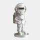 The Lunar Silver Astronaut Star Sculpture - 85cm by Giant Sculptures features a proud stance on a round base, holding a star. With its metallic finish, clear visor helmet, detailed backpack, and space-inspired design, it makes an eye-catching décor piece.