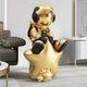 Bring a star-studded astronaut vibe to your living room with the Celestial Gold Astronaut Beats On Star Sculpture - 90cm by Giant Sculptures, featuring a large helmet and headphones on a golden star-shaped seat. Its perfect for modern spaces with neutral colors, cozy couches, and abstract artwork.