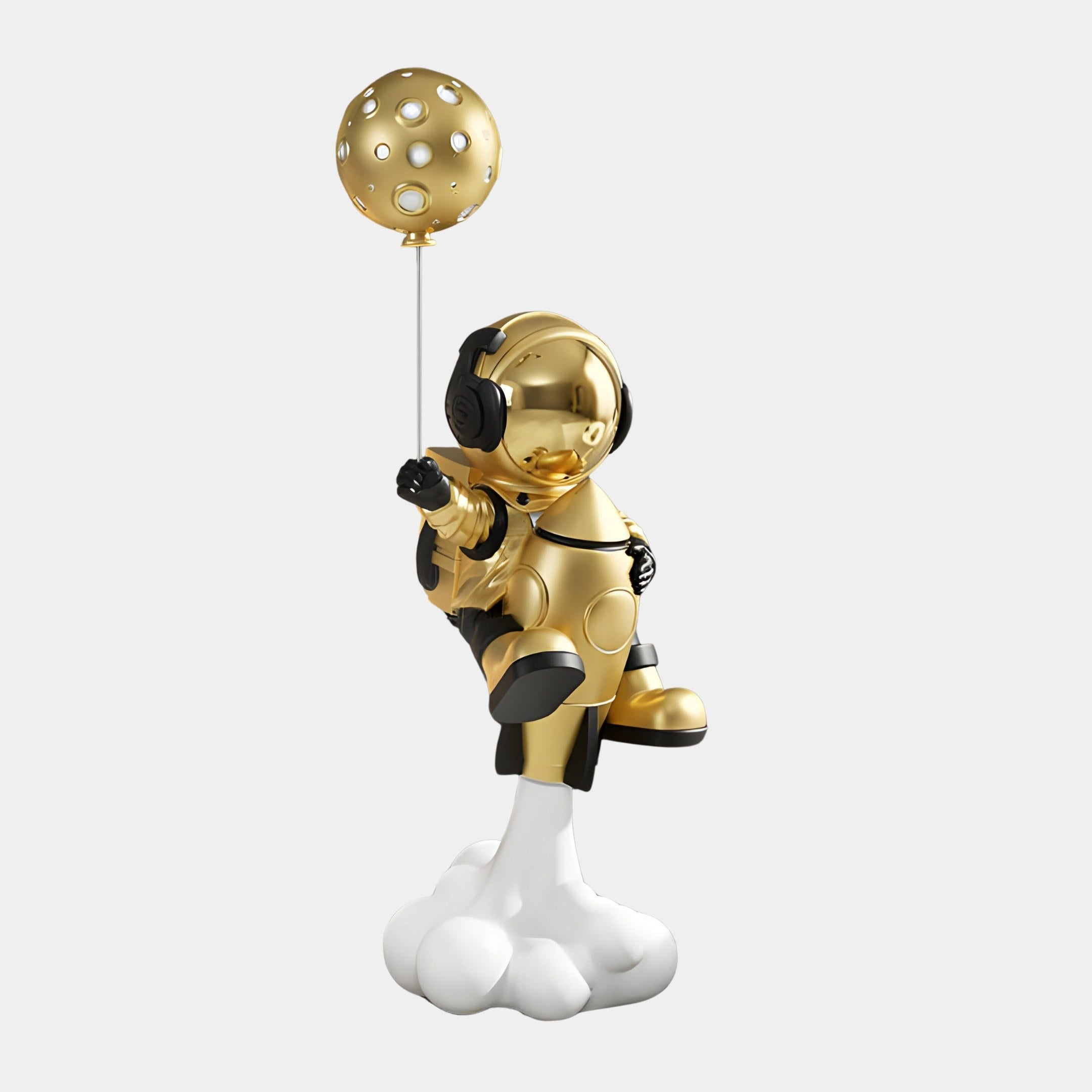 The Giant Sculptures Celestial Gold Astronaut Rocket Lift-Off Balloon Sculpture - 95cm features a futuristic gold astronaut with black accents standing on a cloud, holding a moon-shaped rocket balloon.