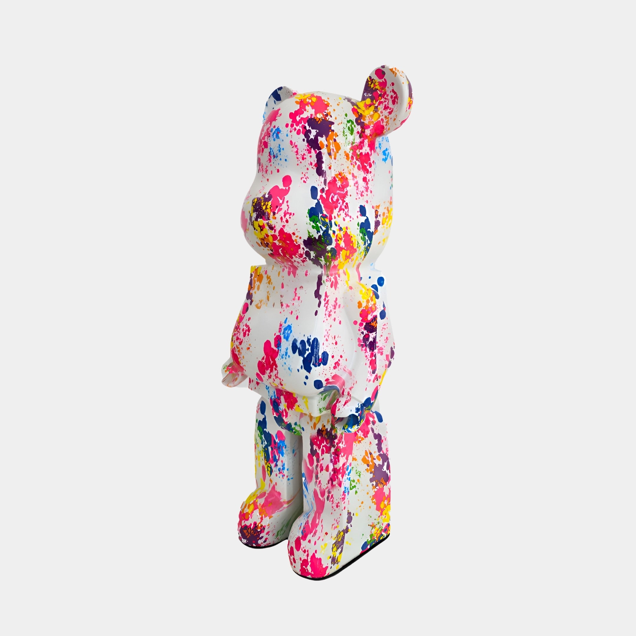 Side view of Splatter Bear Sculpture, showcasing the dynamic splatter paint design in a contemporary art piece.