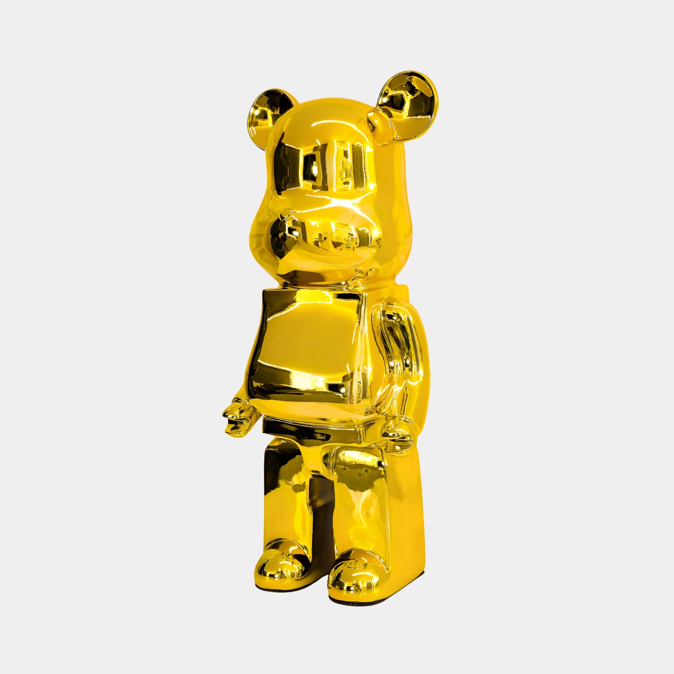 Profile view of the 50cm Gilded Gold bear sculpture with highly polished golden finish.