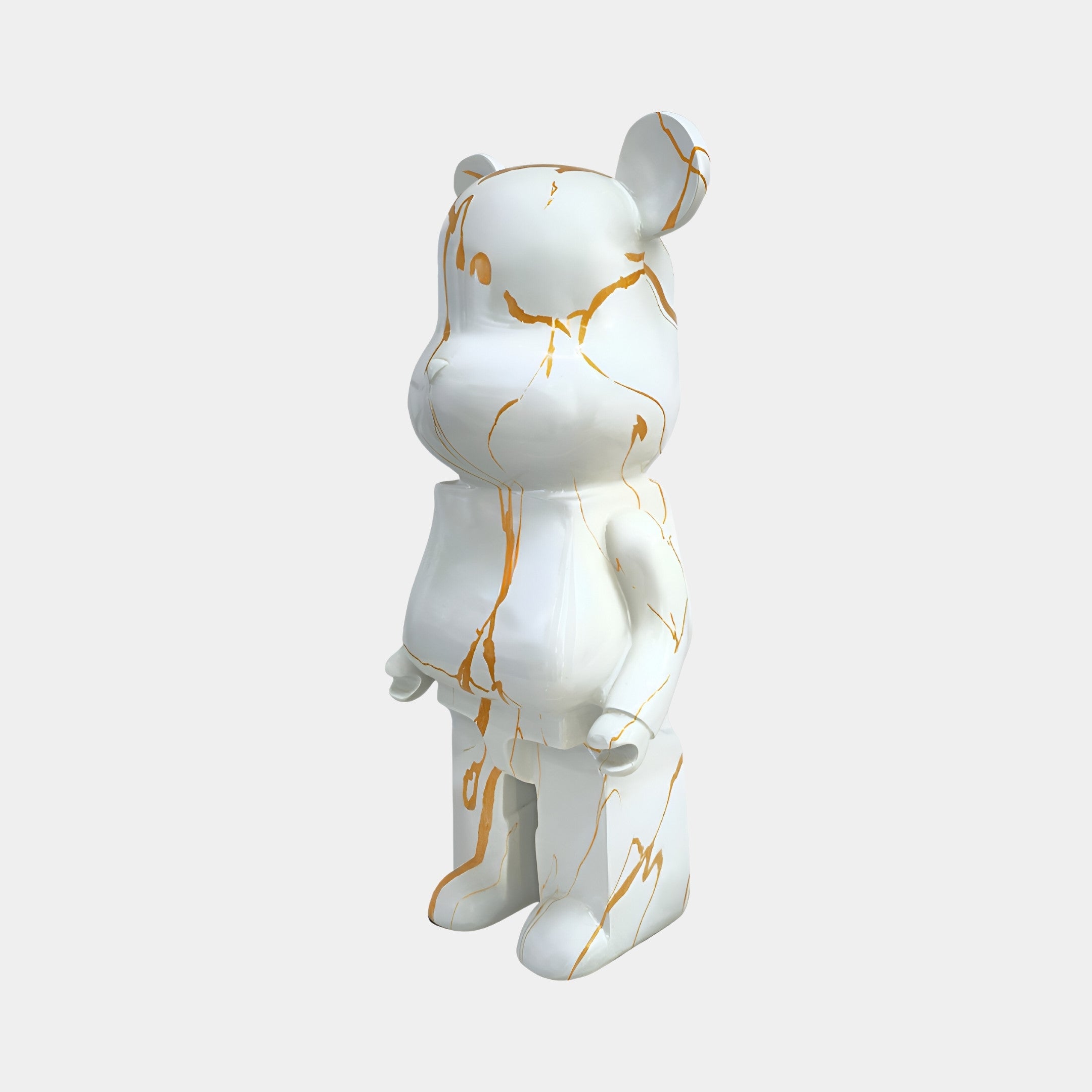 Profile view of the 50cm Golden Luster bear sculpture showcasing a blend of gold and white.