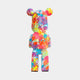 Rear view of the 50cm Hype bear sculpture with bold, multi-colored design on white.