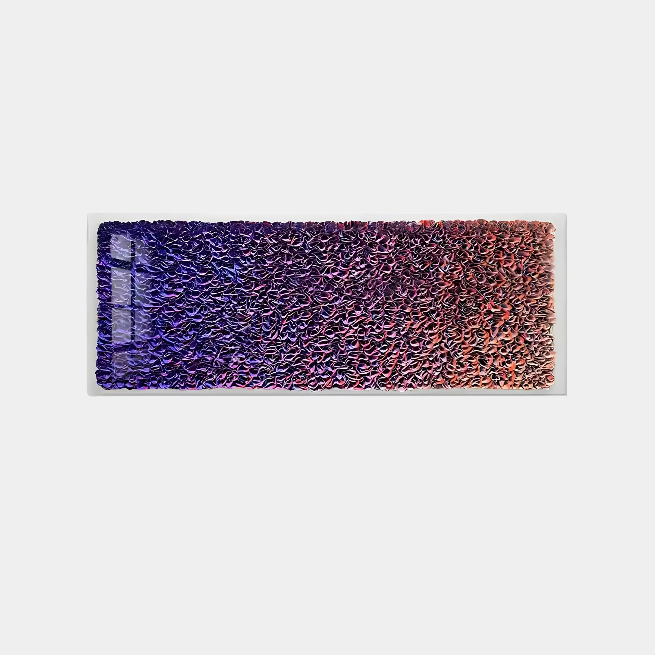 The Chromatica Rectangular Vibrant Purple Gradient Paper 3D Wall Art by Giant Sculptures is a striking piece featuring textured layers with deep purples on the left, transitioning to pink and orange on the right. Its bold statement includes rectangular impressions on the left side.