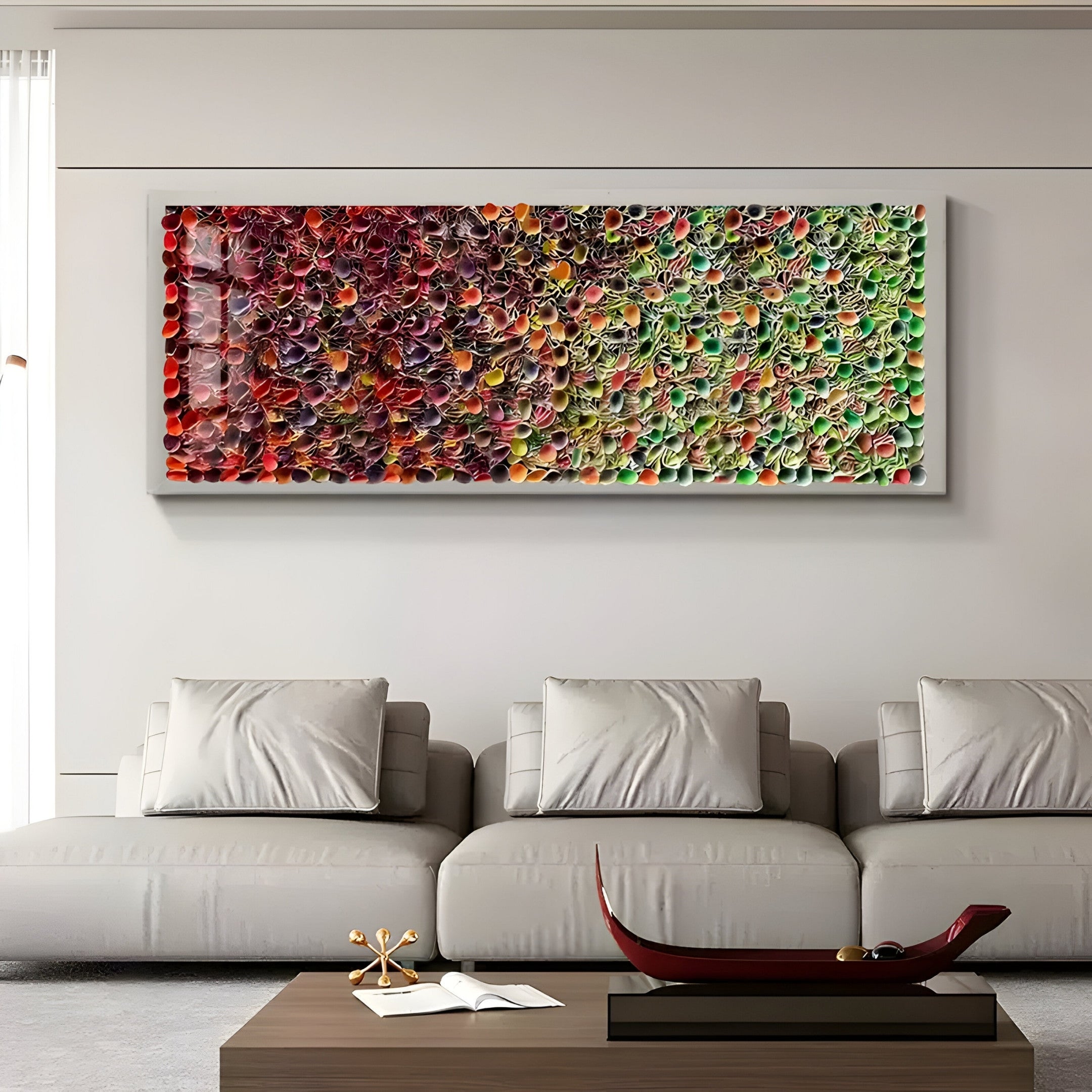 A modern living room boasts a grey sofa and a wooden coffee table. Above, the Chromatica Rectangular Radiant Red & Green Rolled Paper 3D Wall Art by Giant Sculptures adds vibrant color. A decorative red bowl elegantly completes the look on the table.