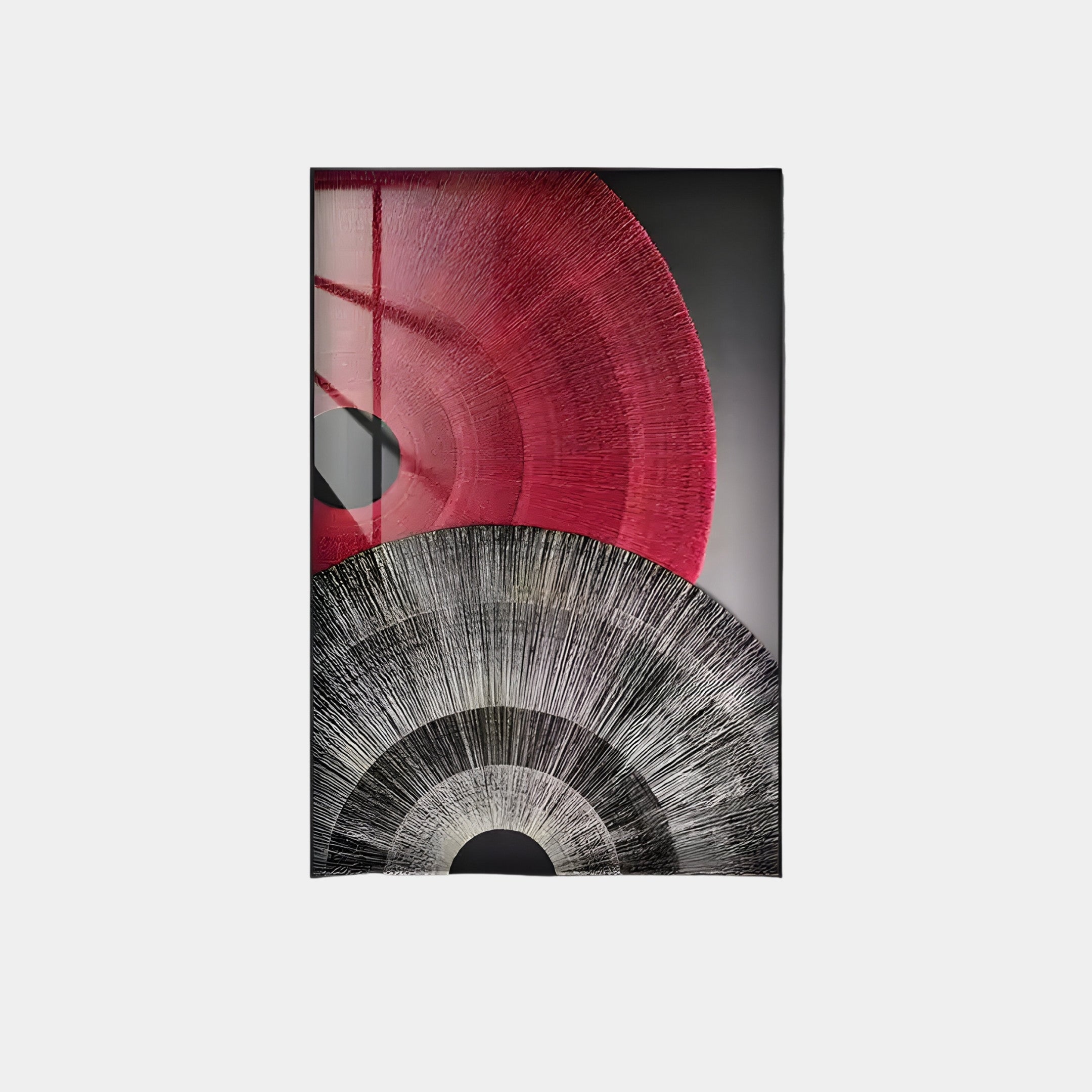 The Auralis wall art by Giant Sculptures features a striking dual concentric circular design. The top semi-circle is in shades of red and maroon, while the bottom contrasts with gray and black, both adorned with radiating lines. Ideal for fans of red & black wall art.