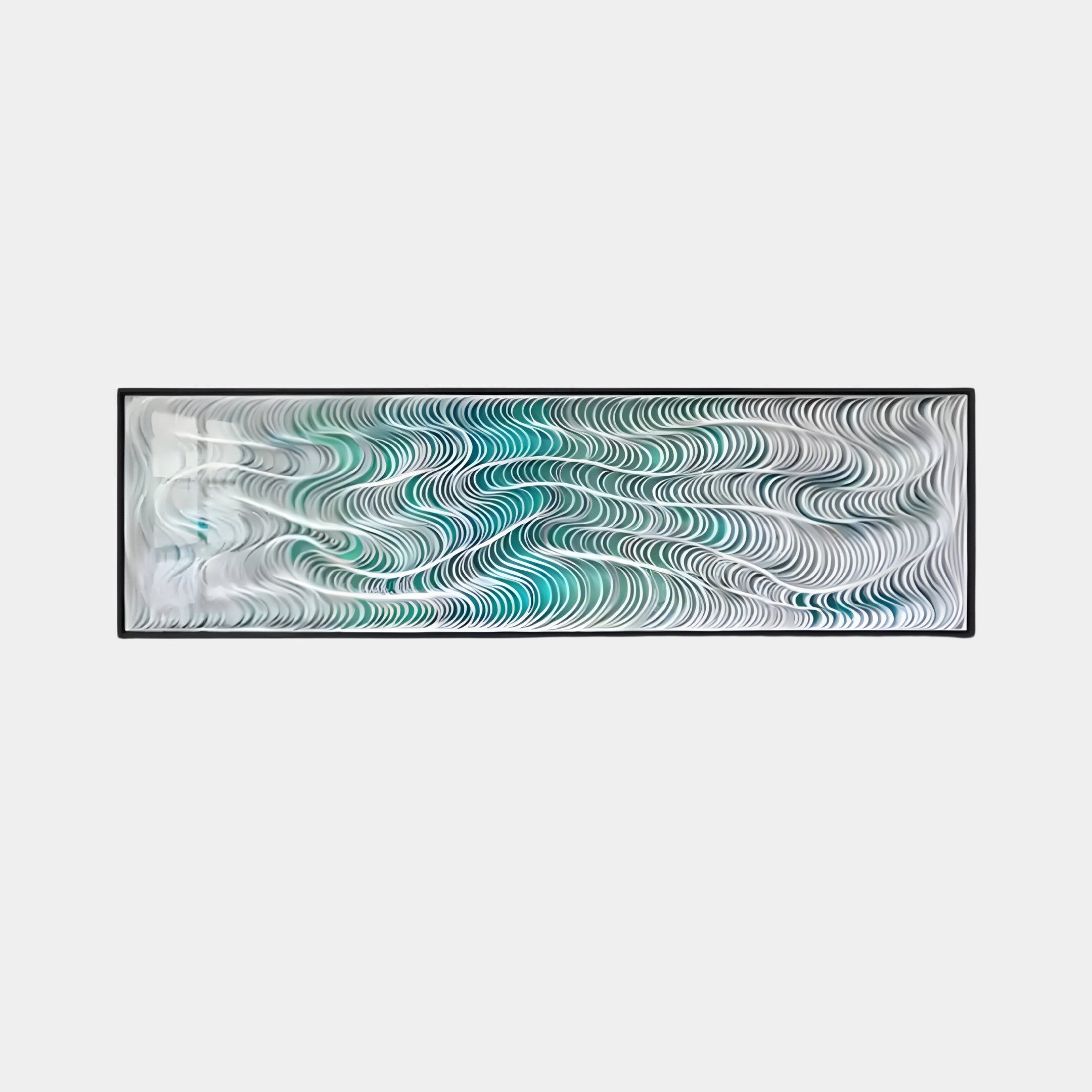 The Fluenta Aqua Ripple Linear Cardboard 3D Wall Art by Giant Sculptures is a rectangular piece with a black frame and undulating wave patterns in black, white, teal, and light blue on a white background, evoking a serene coastal vibe.