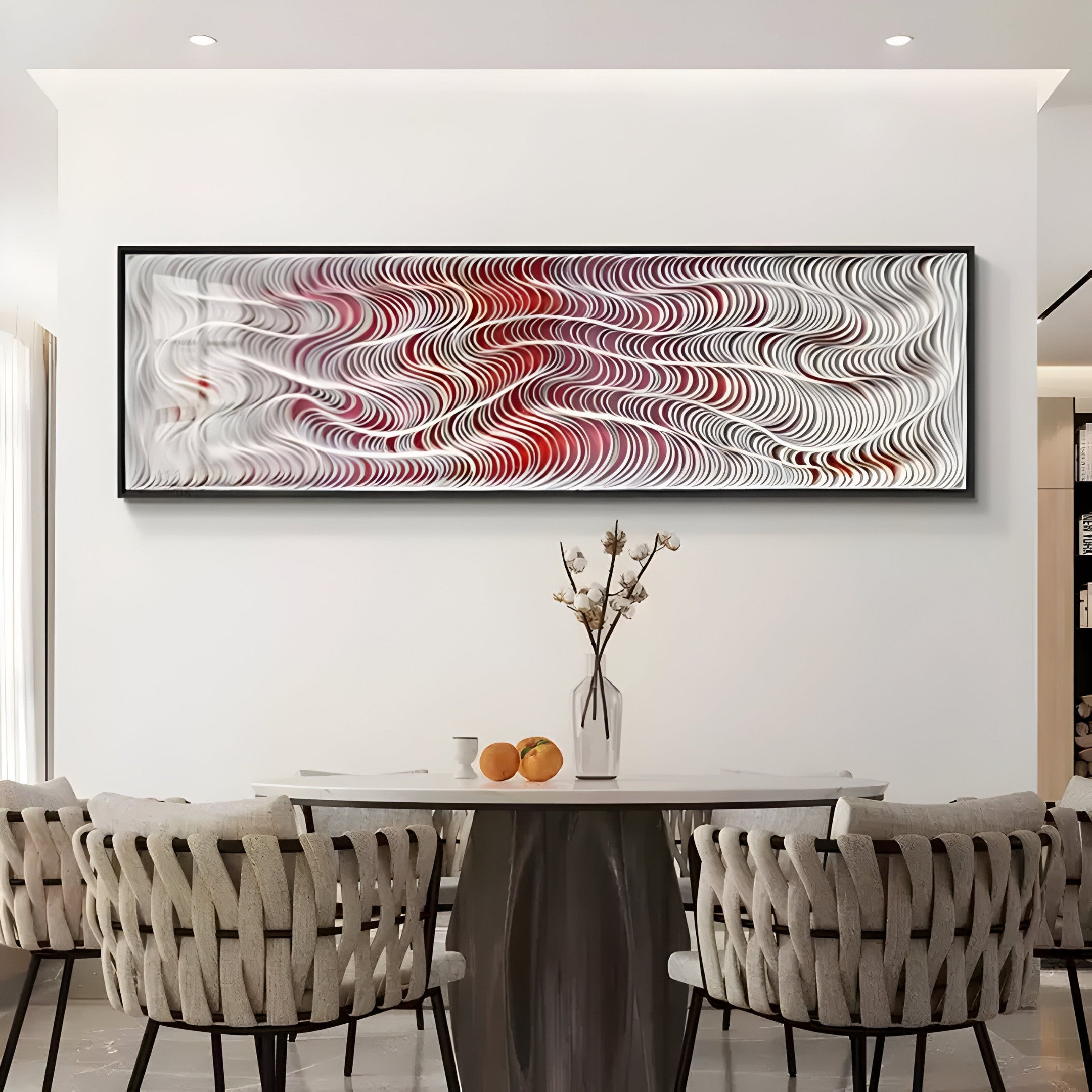 A dining room is enhanced by a table with six chairs, adorned with the Fluenta Scarlet Red Ripple Linear Cardboard 3D Wall Art by Giant Sculptures. A vase holding branches and two oranges adds charm, infusing warmth and style into the space.