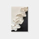 The Stratura I Black & White Layered Paper Canvas Wall Art by Giant Sculptures features textured, minimalist art with white and beige paper forms in a wavy pattern on a black background, evoking a gentle, monochromatic landscape.