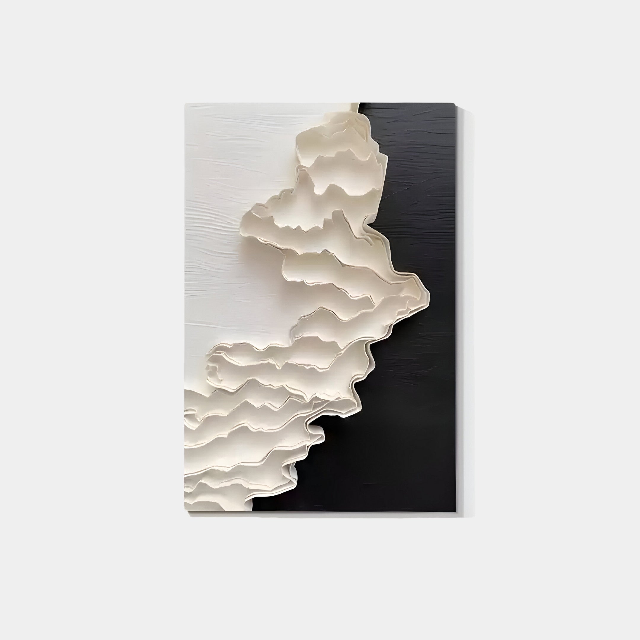 The Stratura II Black & White Layered Paper Canvas Wall Art by Giant Sculptures showcases abstract wavy layers in cream and white that create a 3D effect, merging with a solid black background on the right for a striking contrast with the intricate patterns on the left.