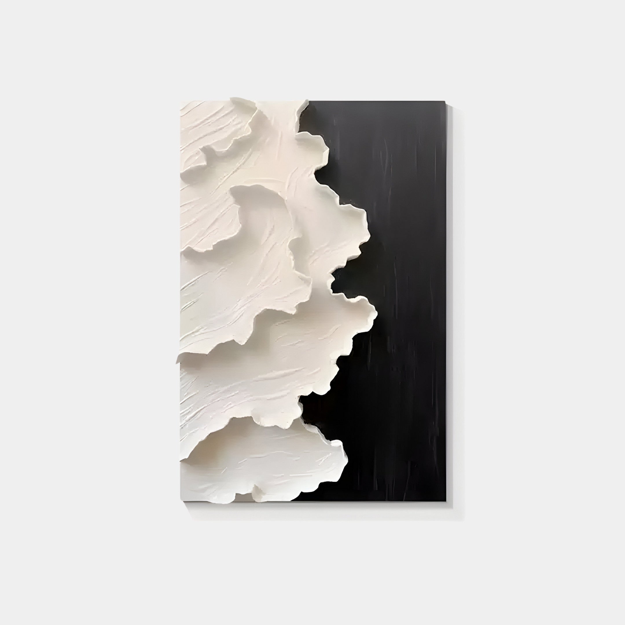 The Stratura III Black & White Layered Paper Canvas Wall Art by Giant Sculptures features a handmade modern abstract design with textured white layers on the left and a smooth black surface on the right, creating a striking contrast.