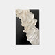 The Stratura IV Black & White Layered Paper Canvas Wall Art by Giant Sculptures presents abstract white, ruffled layers reminiscent of delicate fabric or waves, set against a bold black background to create a stunning monochrome contrast.