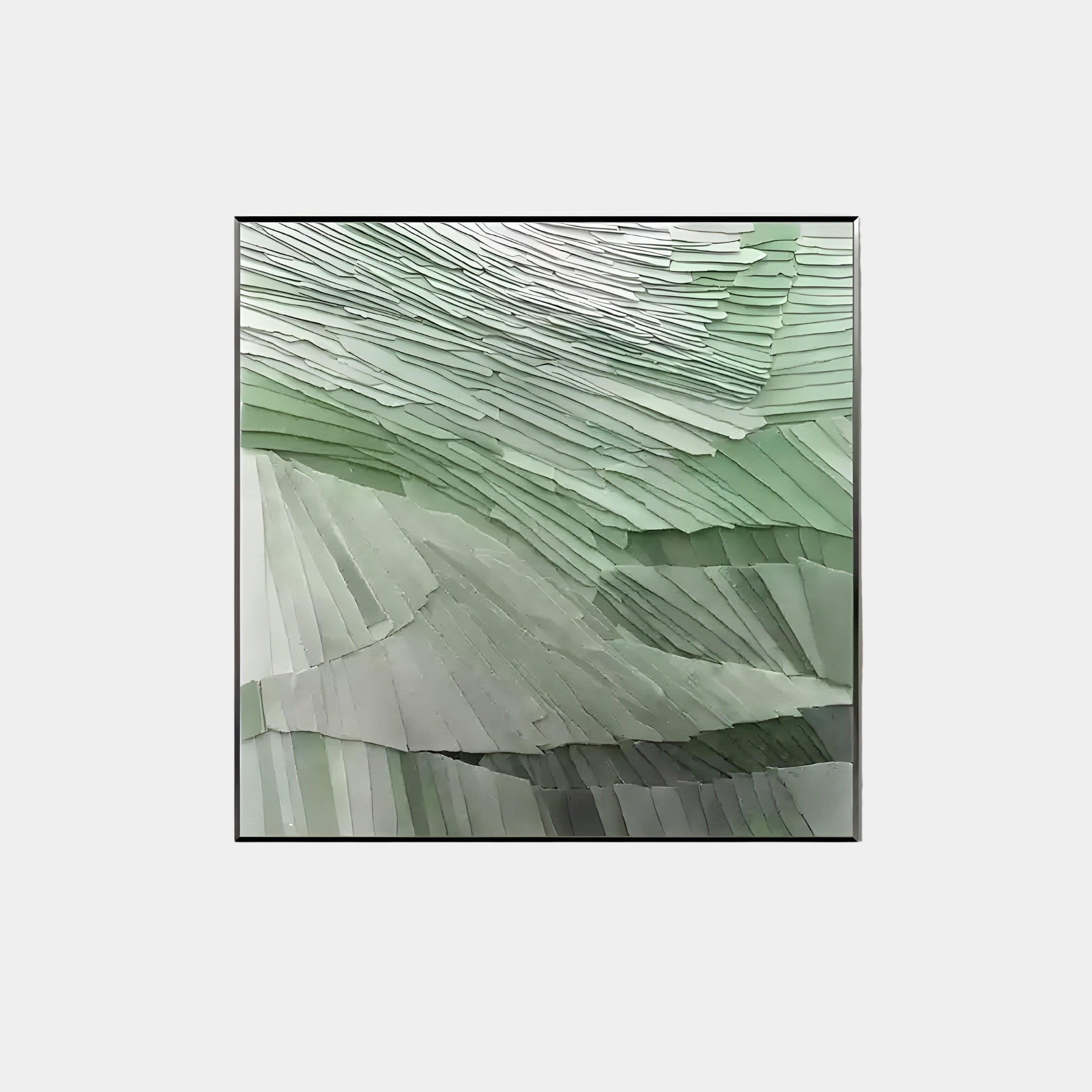 The Terrane Fresh Green Layered Abstract Wall Art by Giant Sculptures features a framed design with green strips of paper forming a textured, flowing pattern. Its gradient shifts from light to dark green, reflecting modern artistry and creating depth and movement.