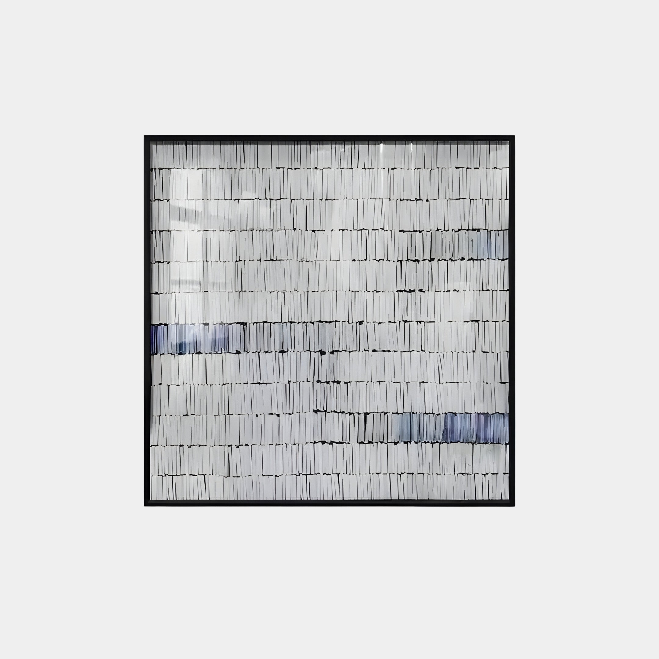 The Tracery VI Blue & White Textured Paper Wall Art by Giant Sculptures features a framed abstract design with parallel lines and rectangles, primarily in black and white with blue accents, creating a layered effect. It beautifully complements contemporary design and versatile spaces.