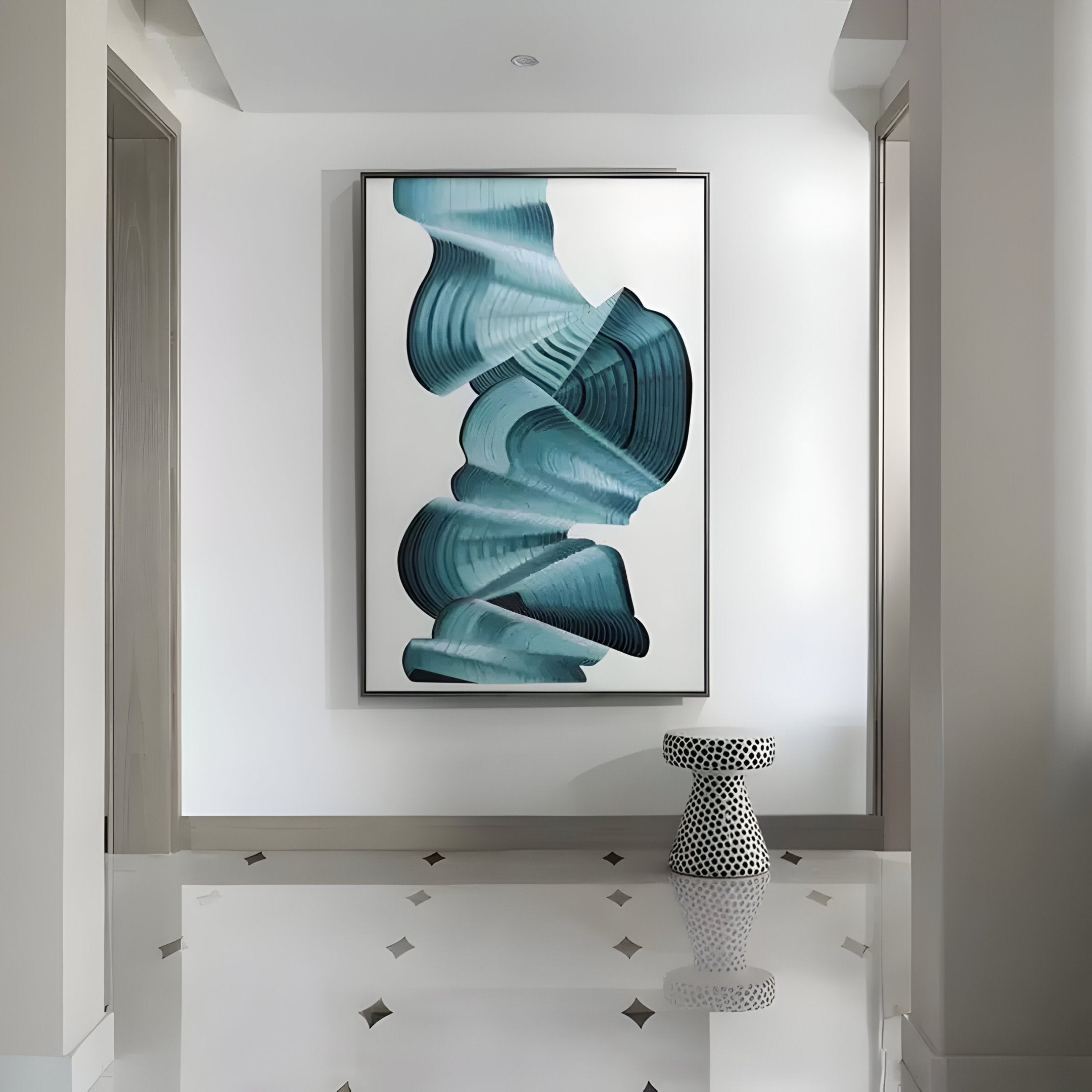 A contemporary hallway showcases the Vortex Blue Spiral Golden Copper Wire Enamel Abstract Wall Art from Giant Sculptures. Below, a small white stool with black polka dots complements the decor, and the floor features a subtle geometric pattern with golden copper wire accents.