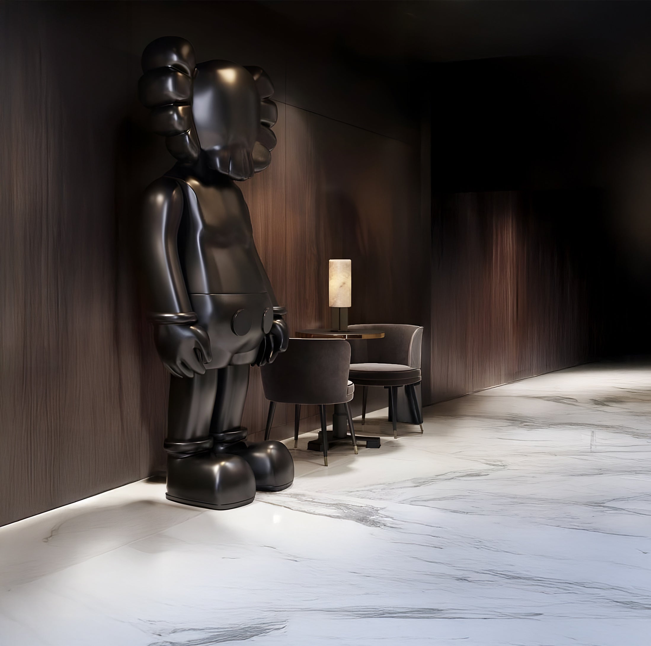 The Midnight Black Iconify Standing Sculpture by Giant Sculptures, resembling a stylized humanoid with crossed eyes and gloved hands, stands beside a round table with two dark chairs and a lit lamp. The setting offers modern elegance with dark wooden walls and a marble floor.