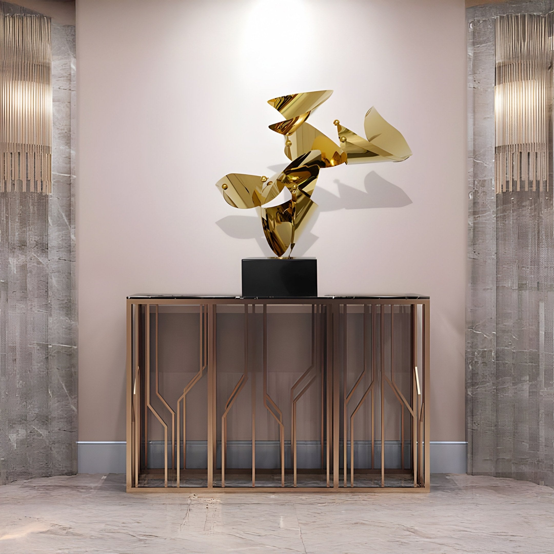 A modern interior showcases a metallic console table with geometric patterns beneath the Giant Sculptures Crest II Gold Abstract Steel Sculpture. Textured grey walls with vertical lights and a marble floor complete the elegant space.