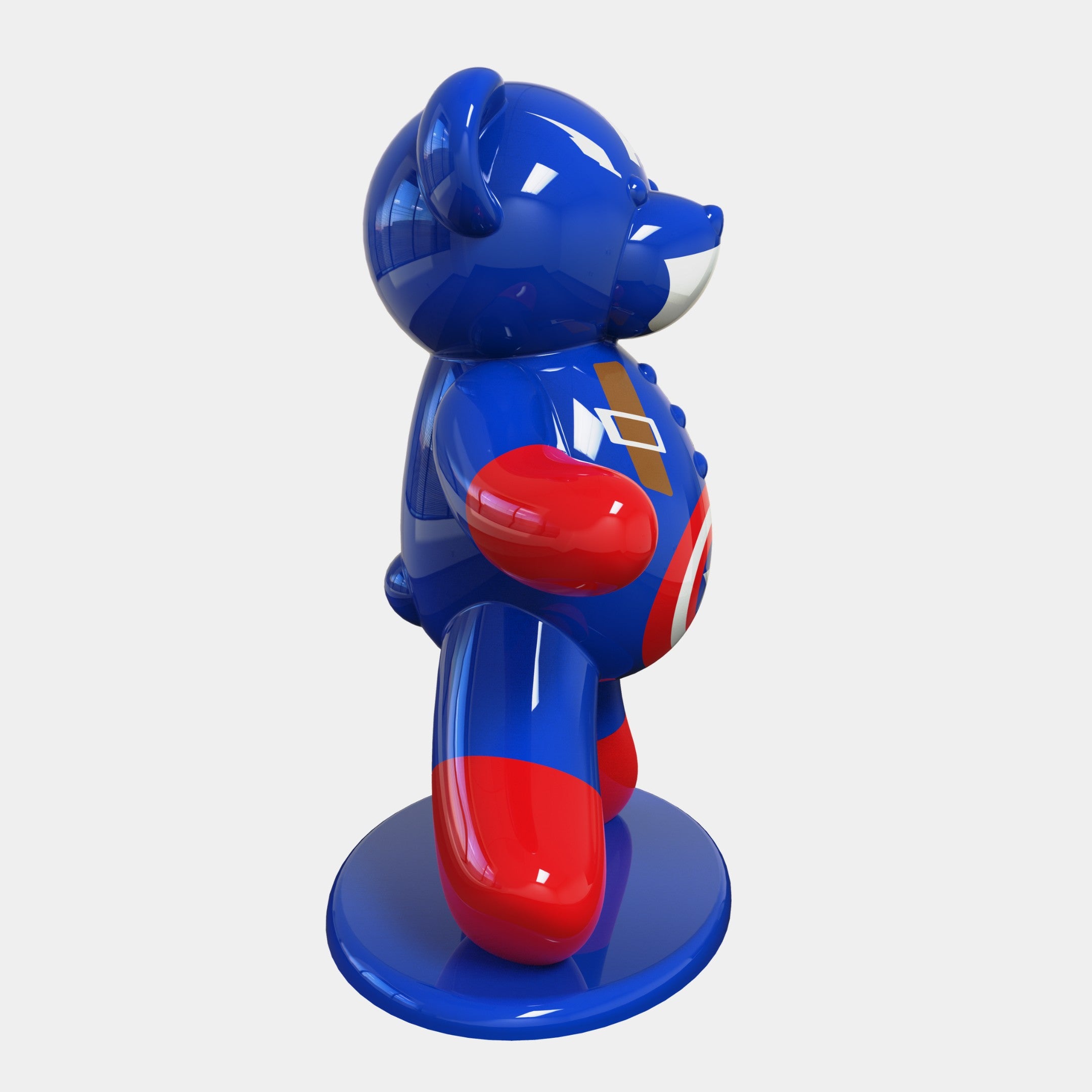 The Gacko Captain America Bear Sculpture by Giant Sculptures is a glossy blue Pop Art bear with red accents and geometric white and gold shapes, showcasing a red emblem on its chest. Standing on two legs on a round base, the 165cm sculpture faces left.