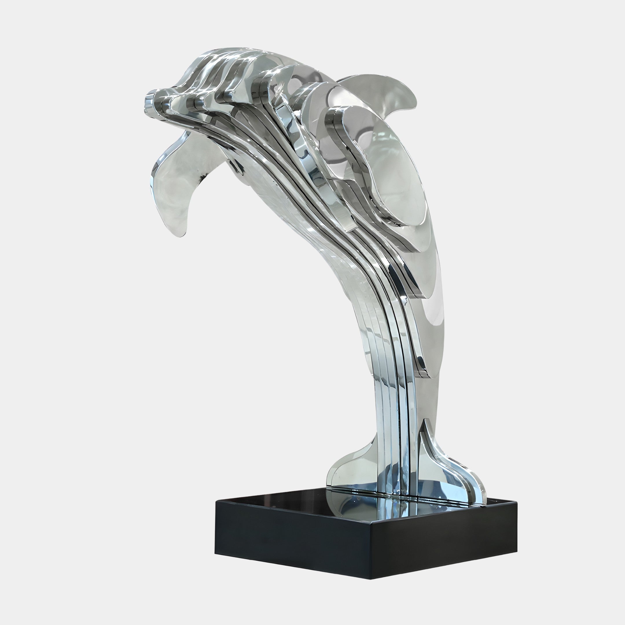 Polished stainless steel dolphin sculpture with sleek lines, reflecting light in a modern outdoor setting. Ideal for garden decor or poolside art.