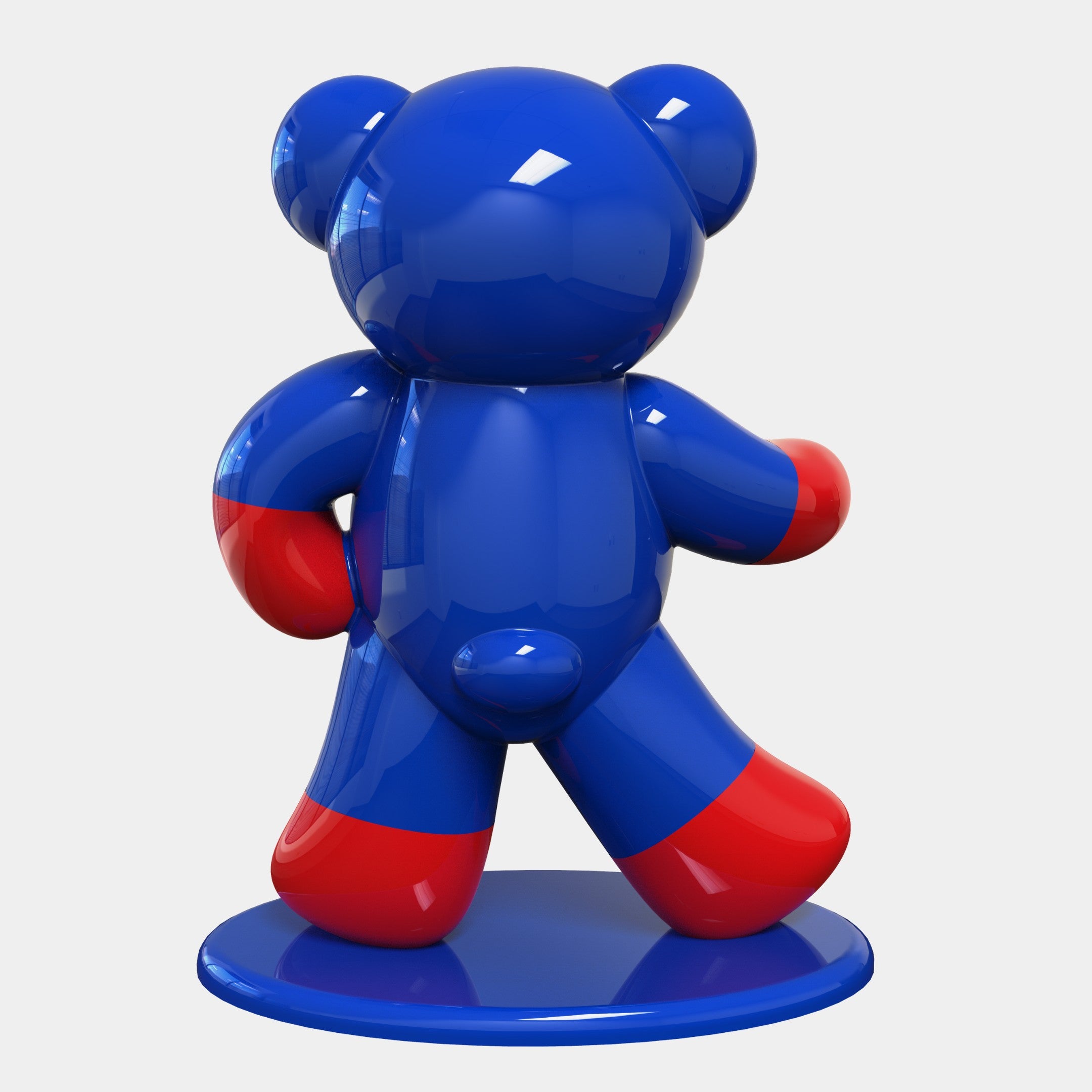 The Gacko Captain America Bear Sculpture - 165cm by Giant Sculptures is a glossy blue bear with red-tipped paws on a circular base, showcasing a smooth, shiny finish and stylized, rounded design inspired by Pop Art aesthetics.