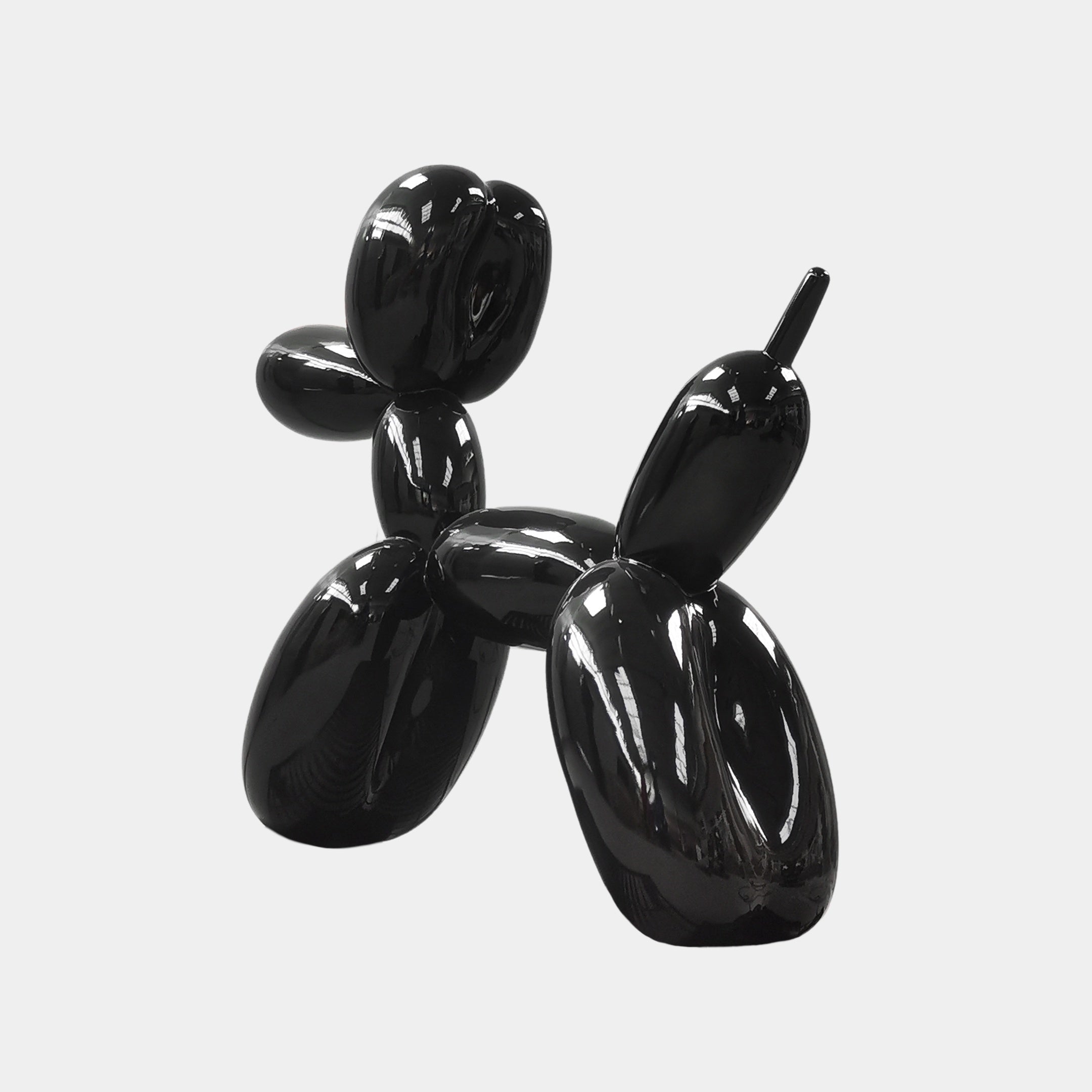 The Onyx Black Balloon Dog Sculpture by Giant Sculptures, measuring 80cm, shines elegantly against a plain white background, capturing the essence of contemporary art.