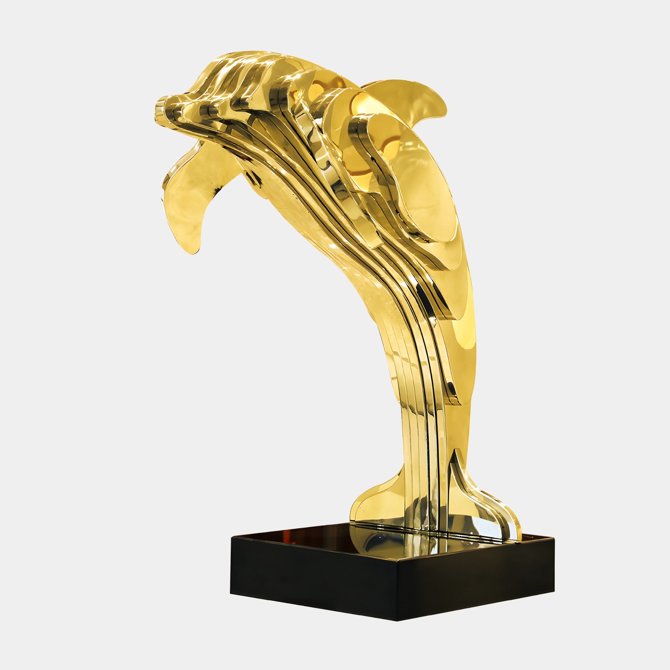 Elegant gold-toned dolphin sculpture crafted from stainless steel, designed as a modern focal point for gardens or upscale courtyards.