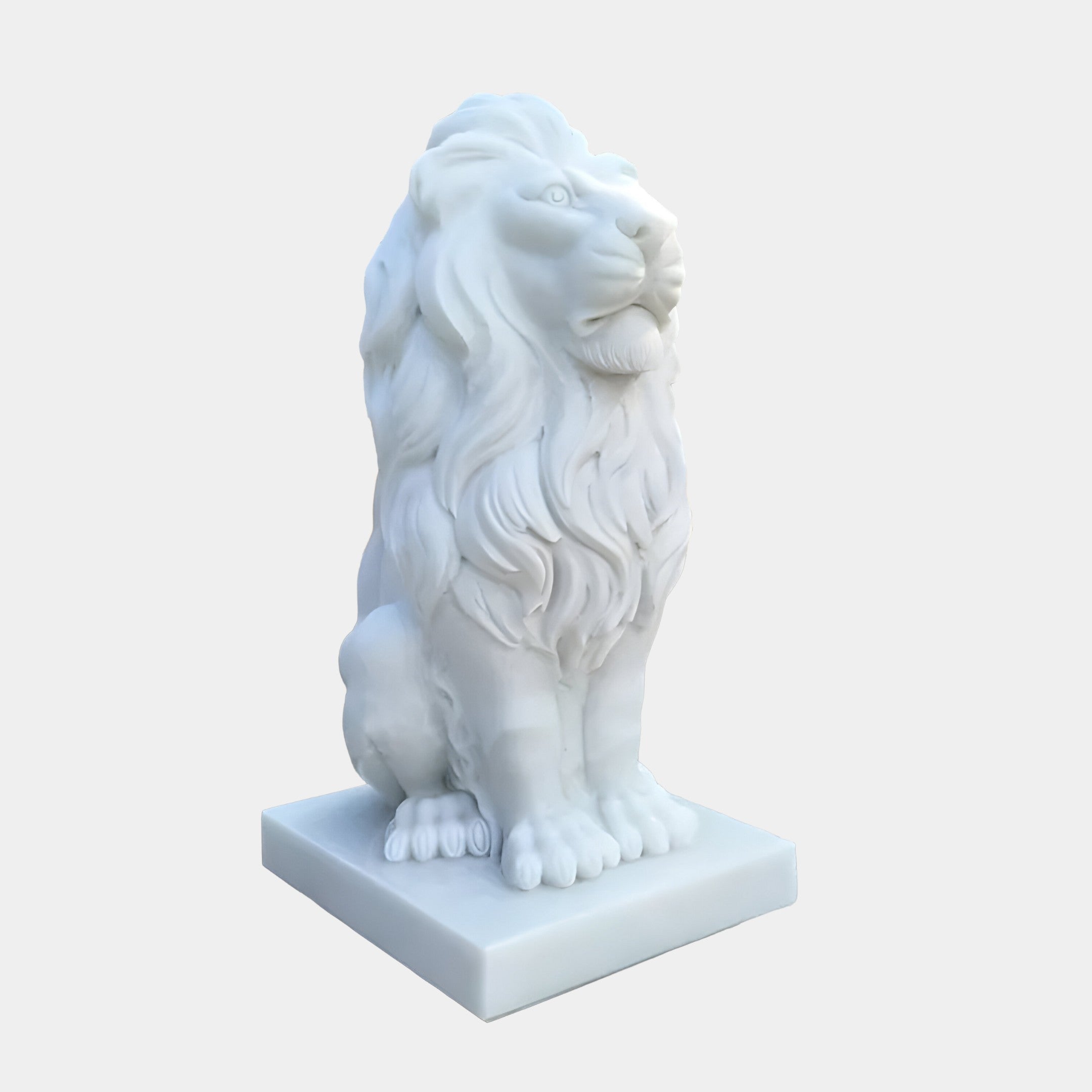 This luxurious art piece, the Giant Gracious Lion Marble Outdoor Sculpture by Giant Sculptures, features a majestic pose with a detailed mane atop a square base. Viewed from a front-side angle against a plain background, it exemplifies exquisite craftsmanship and sophistication.