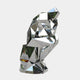 Abstract geometric silver human sculpture, seated with a bent knee, made from faceted, mirror-like polygons, reflecting its surroundings.