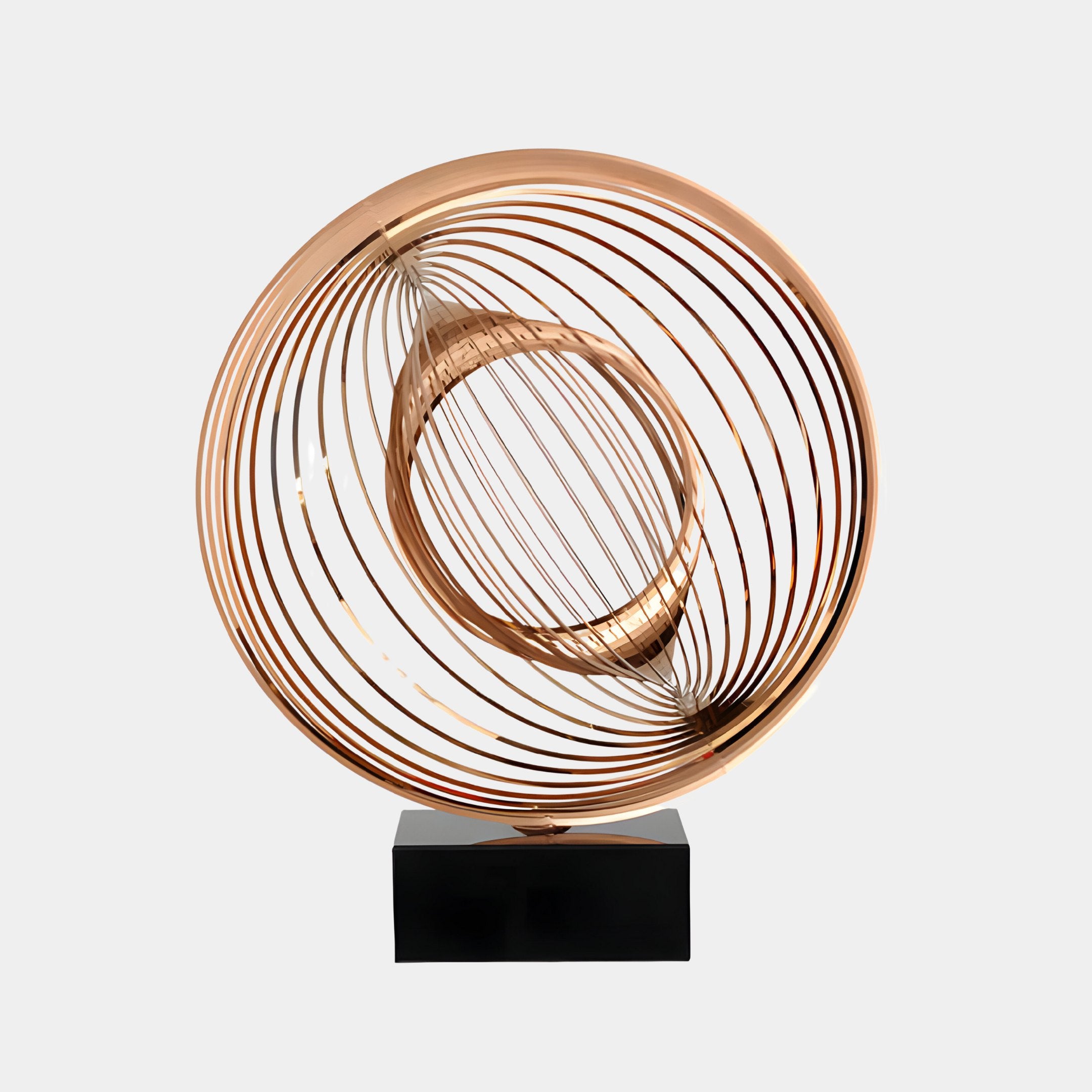 Circular copper sculpture with concentric rings creating an illusion of motion, mounted on a black base.