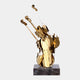 Artistic violin sculpture in gold with detailed cutouts, mounted on a black base.