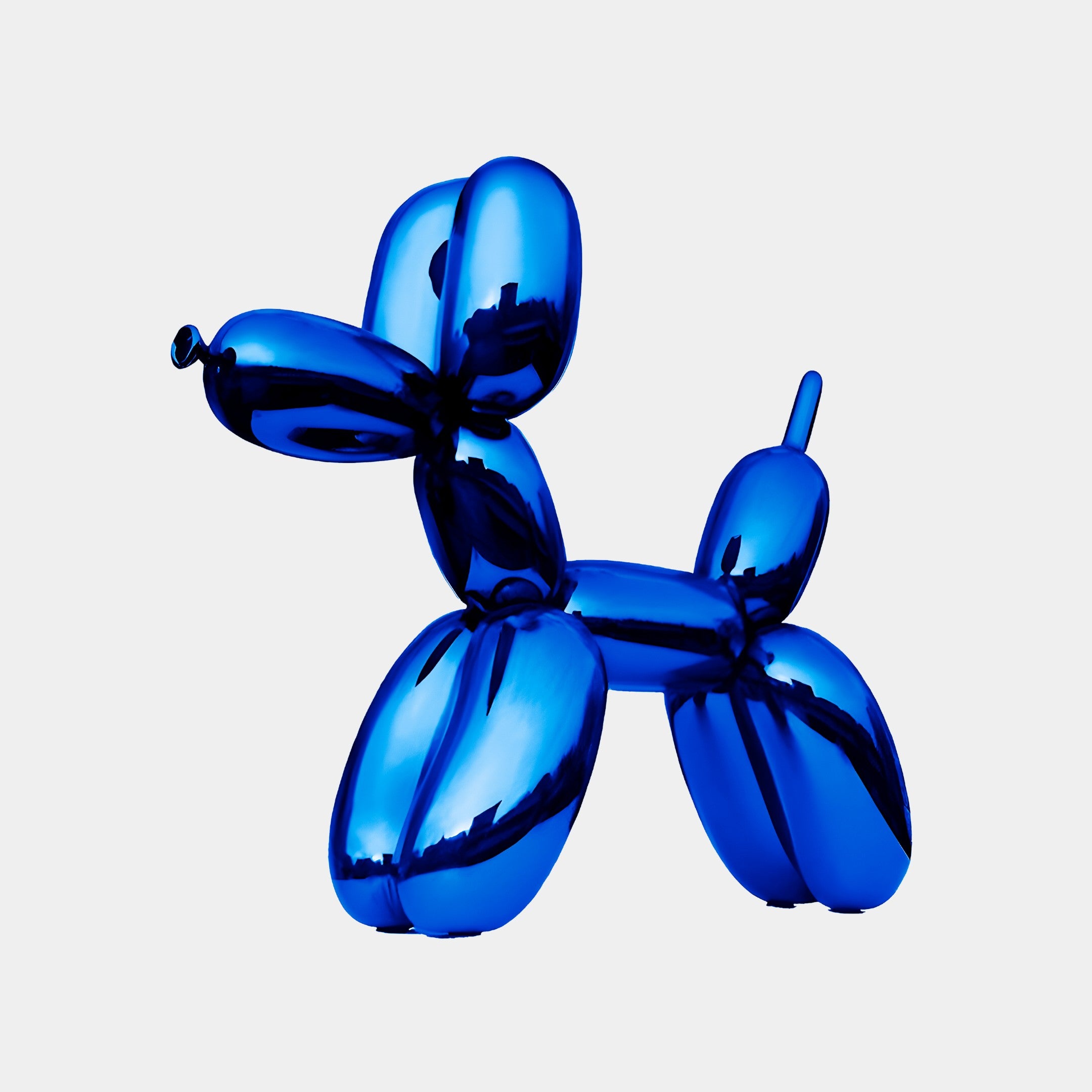 Shiny blue dog sculpture with a reflective surface, standing in a playful pose with its tail raised. The sculpture is 90cm in height and features smooth, rounded forms that resemble a balloon animal.