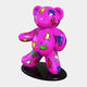 The Gacko Keith Haring Bear Sculpture by Giant Sculptures stands 165cm tall, featuring a shiny pink bear adorned with colorful pop art figures in yellow, blue, red, and green. It is reminiscent of the iconic style and stands on a glossy black oval base as a limited edition masterpiece.