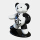 The Gacko Channel Bear Sculpture by Giant Sculptures is a 165cm glossy black and white pop art piece, featuring prominent CC letters on its chest. It stands on a matching oval base, boasting button-like eyes and a stitched nose.