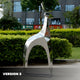 Another angle of the stainless steel deer sculpture, showing its form and reflective properties in a landscaped environment.