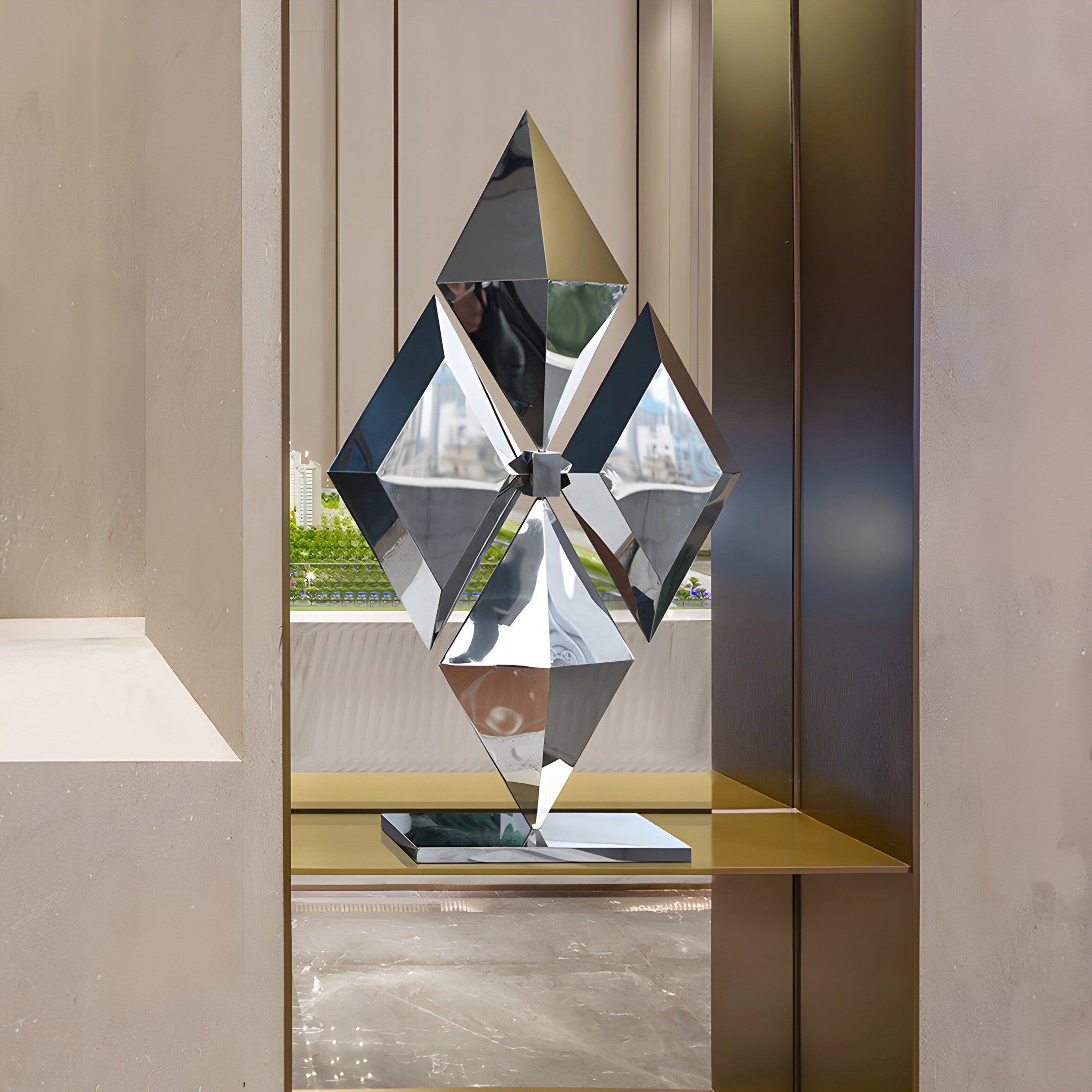 A striking, polished diamond-shaped stainless steel sculpture displayed on a sleek platform, ideal for modern art collections or luxury home décor.