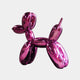 The Phantom Purple Balloon Dog Sculpture (80cm) by Giant Sculptures stands against a plain white background. This contemporary art piece boasts glossy surfaces and shiny, inflated balloon-like shapes forming its playful dog body, legs, tail, and head.