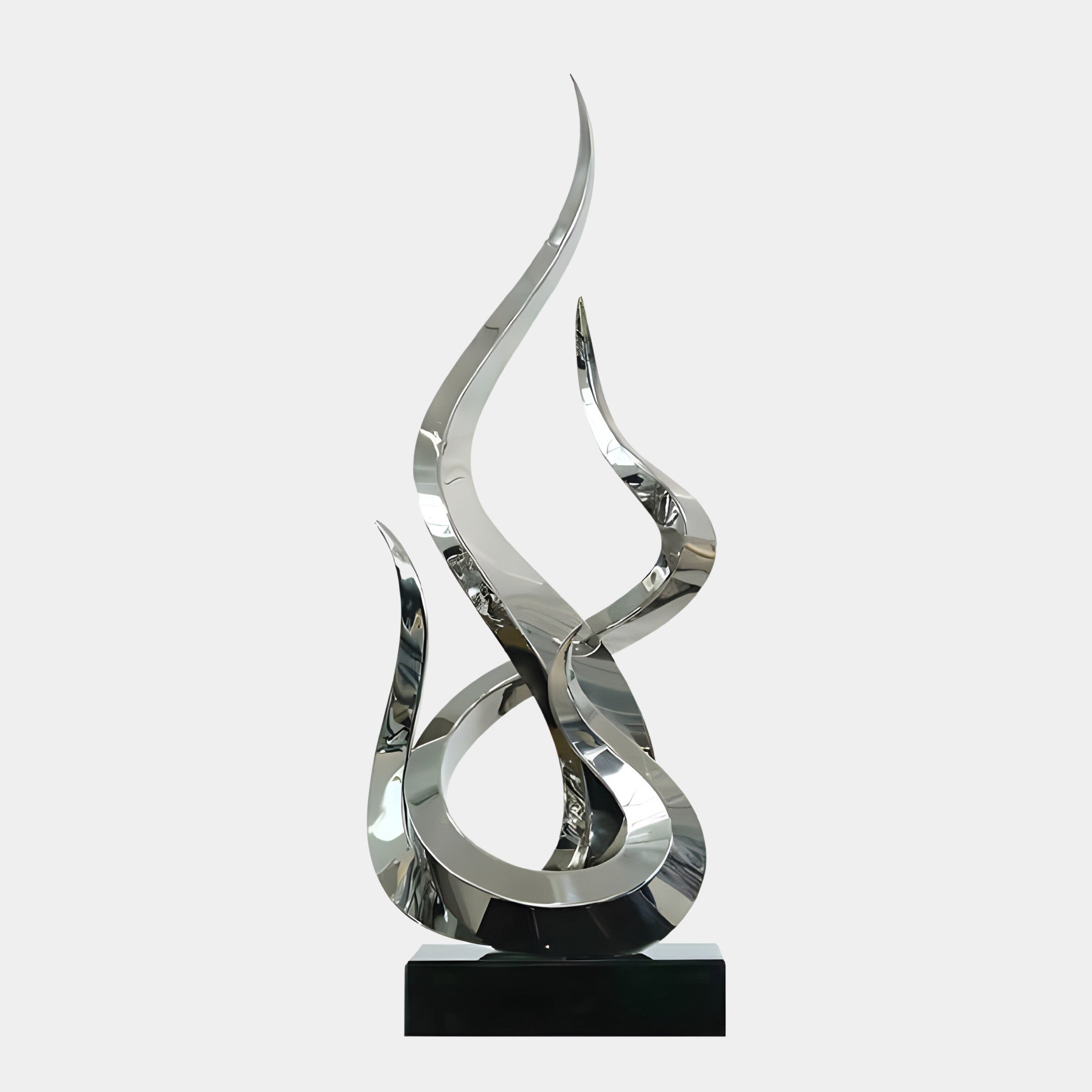 A silver abstract sculpture with two intertwined elements, mounted on a black pedestal.