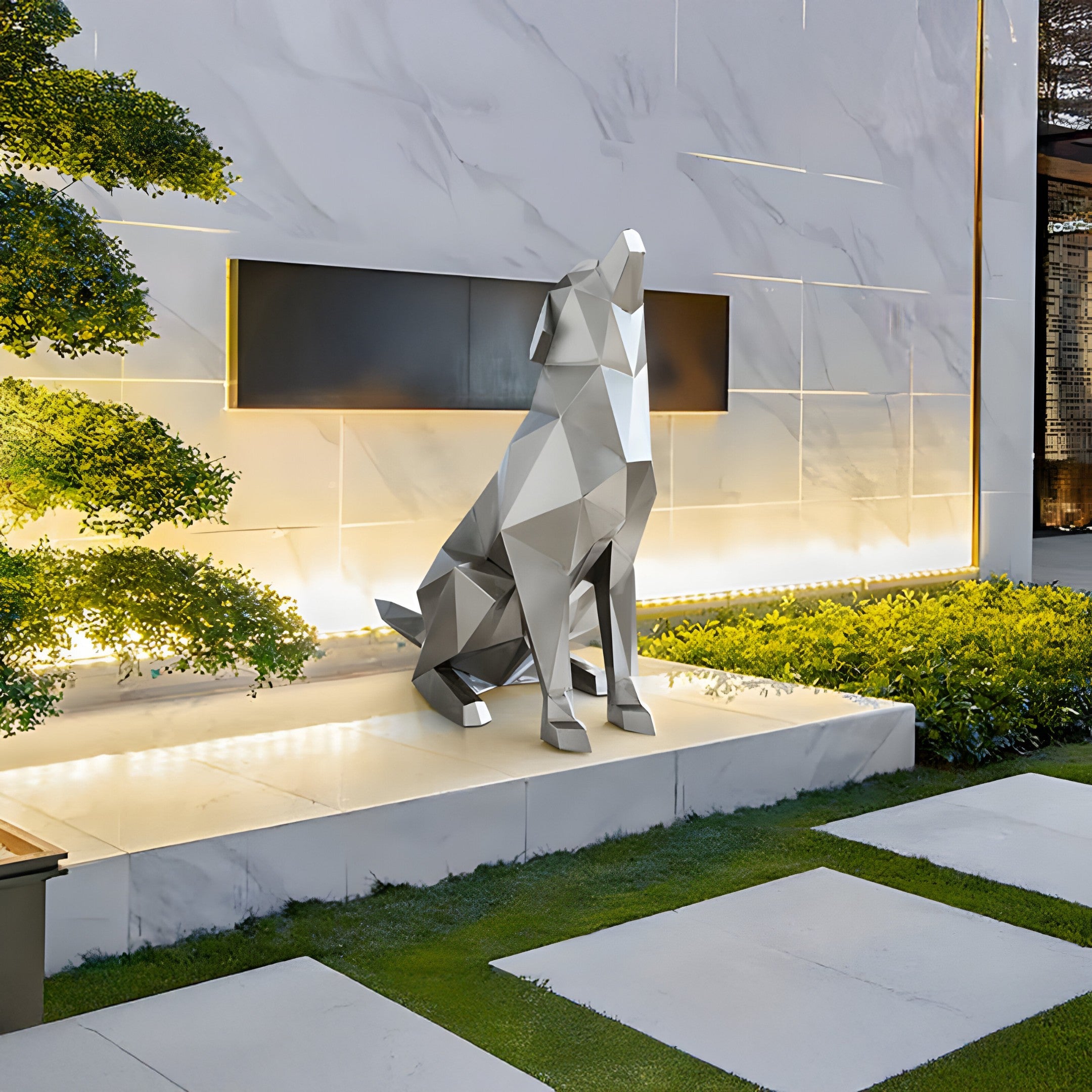 Outdoor installation view of a silver geometric dog sculpture placed near a modern garden setting, with a concrete floor and lush greenery in the background.