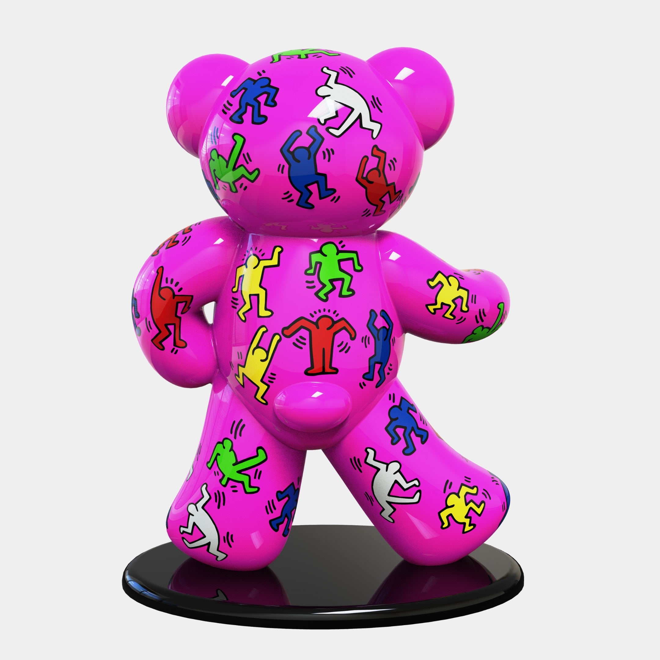 The Gacko Keith Haring Bear Sculpture by Giant Sculptures stands on a black circular base, exuding pop art flair with its shiny pink bear shape adorned in colorful, cartoon-style dancing figures. This 165cm limited edition piece adds a lively vibe with red, green, yellow, blue, and white hues.