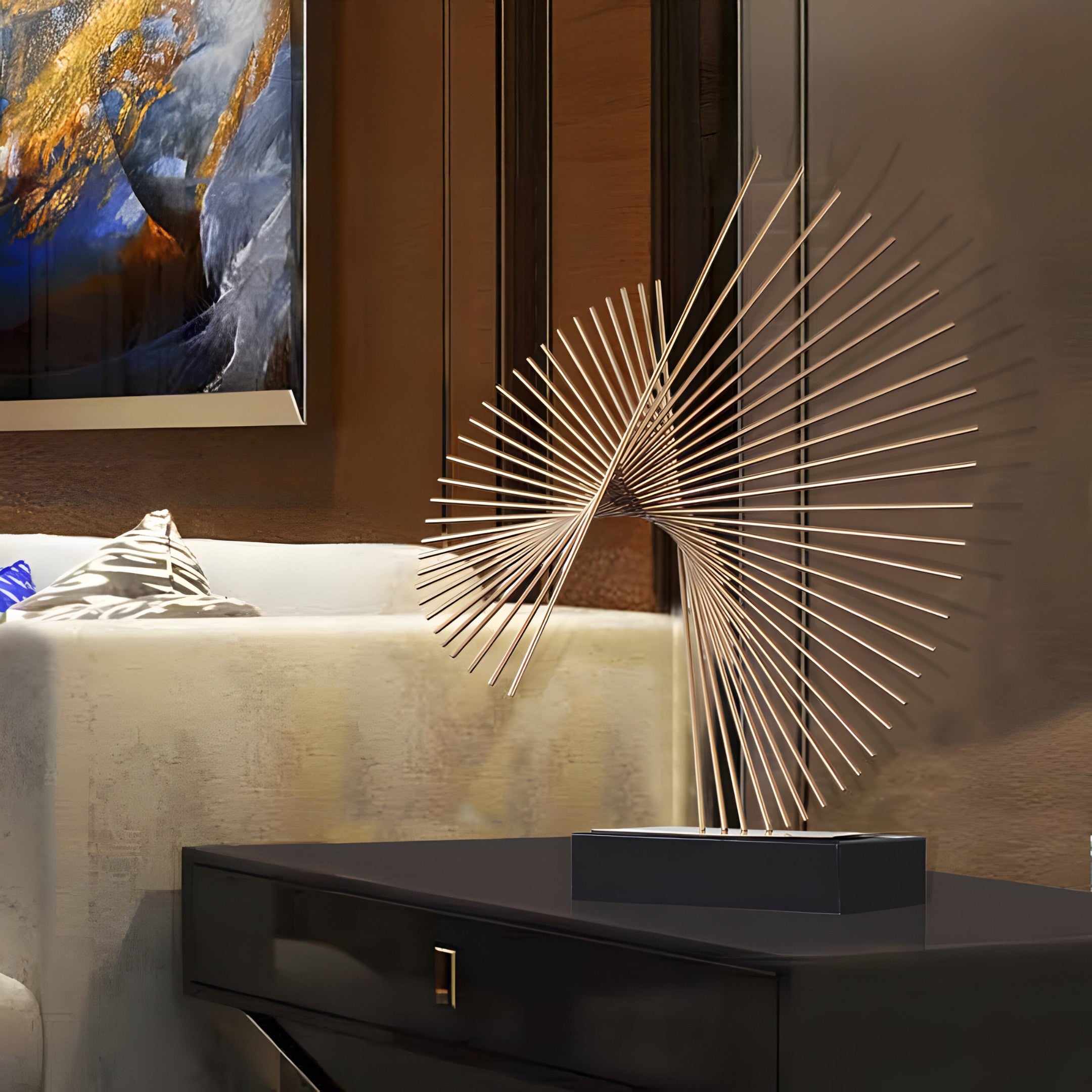 A modern abstract sculpture made of thin golden rods arranged in a spiral pattern, displayed on a sleek black side table in a luxurious living room.